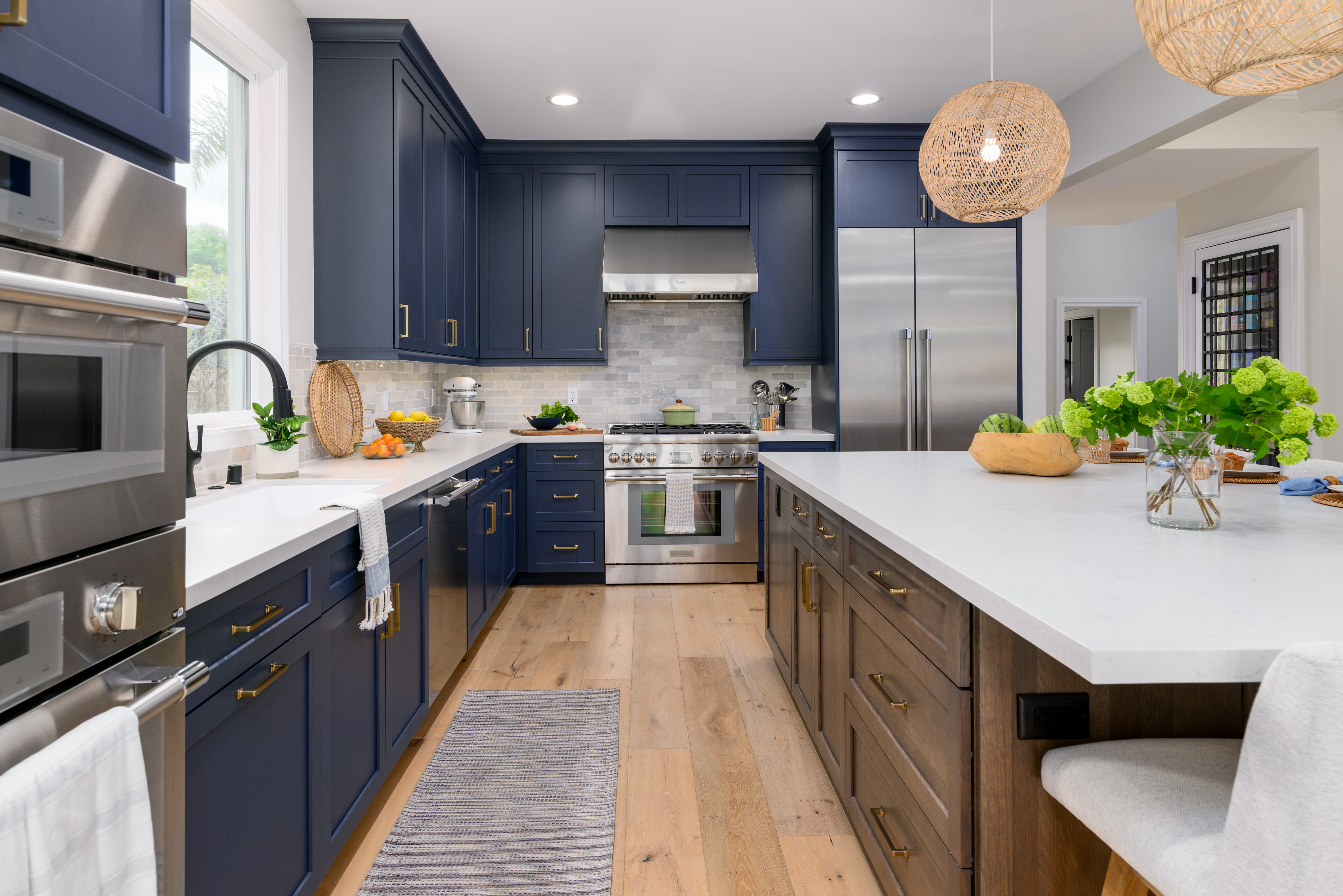 Navy blue kitchen remodel with gold hardware