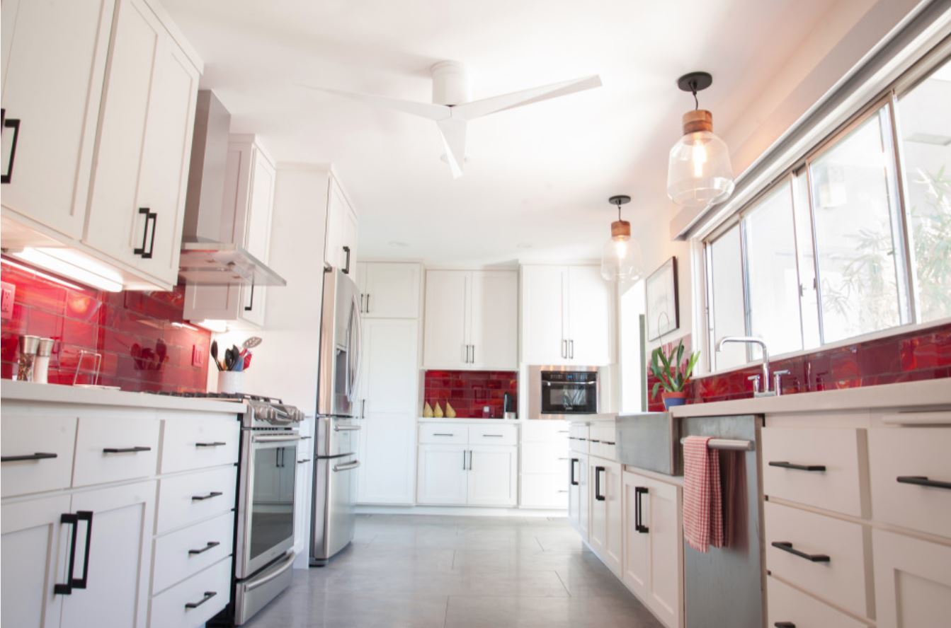 White kitchen with red backsplash