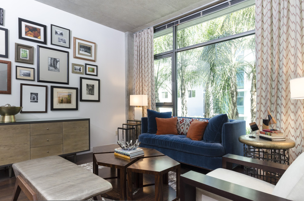 Loft living room with gallery wall and floor to ceiling windows